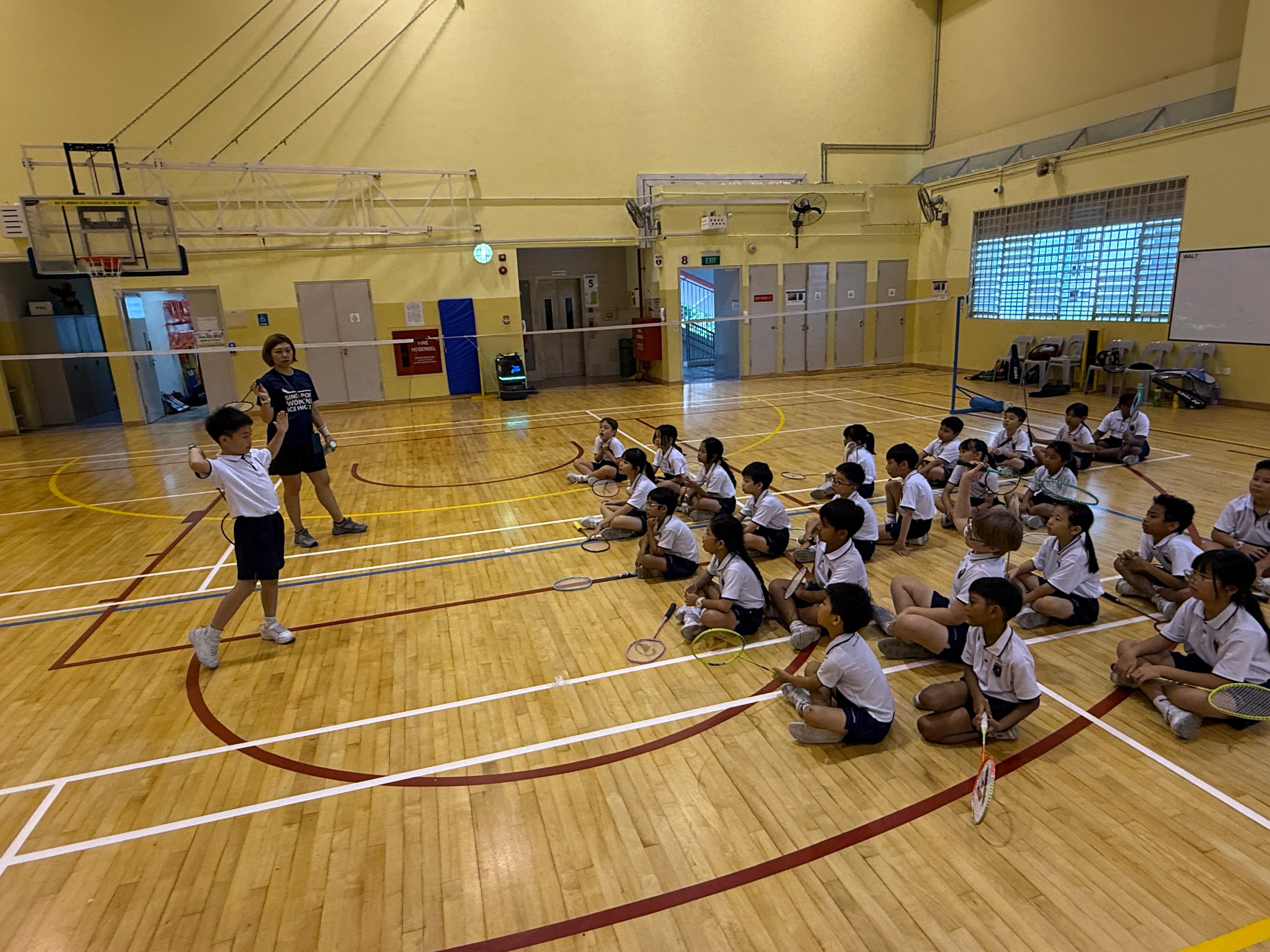 Students practicing in the school hall